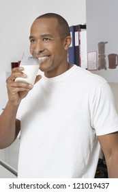 Portrait Of African American Man Drinking Milk At Home