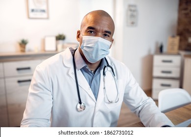 Portrait Of African American Medical Expert Wearing Protective Face Mask At Doctor's Office And Looking At Camera.