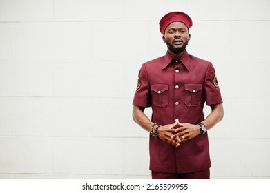 Portrait Of African American Military Man In Red Uniform And Beret.