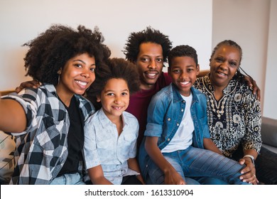 Portrait Of African American Multigenerational Family Taking A Selfie Together At Home. Family And Lifestyle Concept.