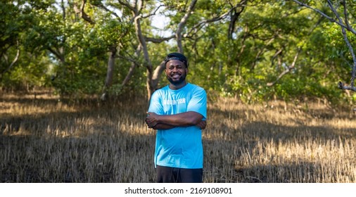 Portrait Of African American Volunteer Man Enjoy Charitable Social Work Outdoor In The Mangrove Planting Project