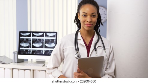 Portrait Of African American Woman Doctor Smiling In Hospital