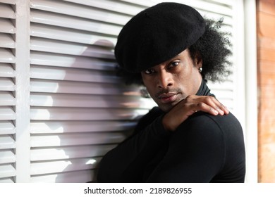 Portrait Of African American Young Adult Male Looking At Camera With Serious Gesture. Alternative Fashion And Lifestyle. 