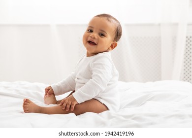 Portrait Of African Baby Toddler Smiling Sitting On Bed Indoor - Shutterstock ID 1942419196