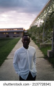 Portrait Of African Black Man Outdoors In Village At Night While Thinking