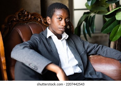 Portrait Of African Business Woman Sitting On Couch In The Office 