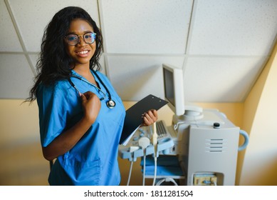portrait of african female doctor at workplace - Shutterstock ID 1811281504