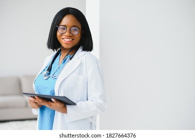 Portrait Of African Female Doctor At Workplace