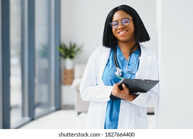 Portrait Of African Female Doctor At Workplace