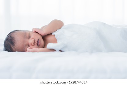 Portrait of African little infant or baby wearing diaper and sleeping on bed with comfort. New born kid concept.