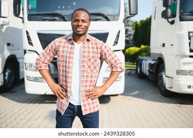 portrait African male happy Smiling confident positive near lorry. Young Man plaid shirt owner Truck Driver In Business Long transport thumbs up satisfied service commercial driving license training. - Powered by Shutterstock