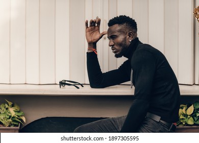 Portrait Of African Model Smoking Cigar And Posing For Photography.