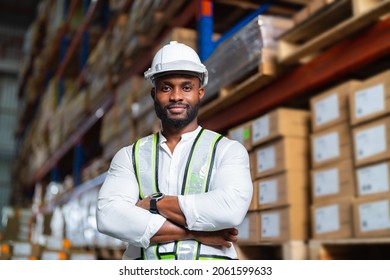 Portrait of African warehouse manager standing in a large distribution center. concept of career and occupation.