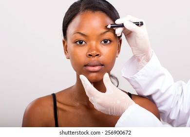 portrait of african woman before marking her face for face lifting - Powered by Shutterstock