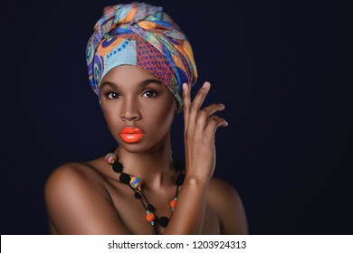 Portrait Of African Woman With A Colorful Traditional Shawl On Her Head