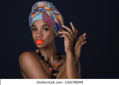 Portrait Of African Woman With A Colorful Traditional Shawl On Her Head