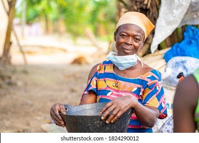 Portrait Of African Woman, Face Mask Lowered At The Chin- Out Door Concept
