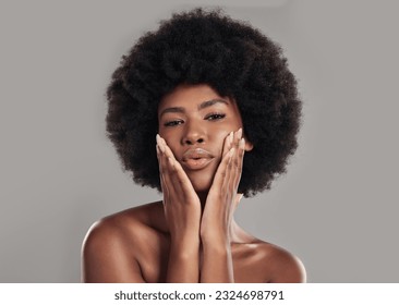 Portrait, african and woman is feeling with glowing skin in studio background for wellness with afro. African, woman and makeup with dermatology or beauty with facial treatment for self care.