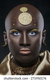 Portrait Of An African Woman With Traditional National Pattern On Head With Blue Eyes