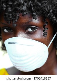 Portrait of African Woman Wearing Face Mask Against Infection of Bacterira, Virus