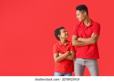 Portrait of African-American brothers on color background