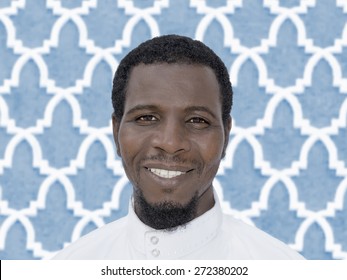 Portrait of an Afro man wearing a white djellaba