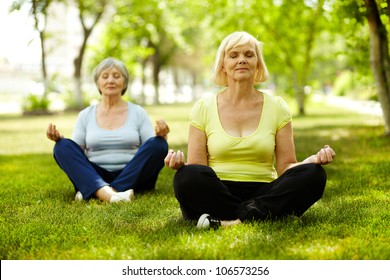 Portrait Of Aged Women Doing Yoga Exercise