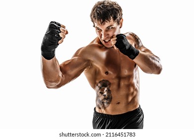 Portrait of aggressive boxer training and practicing uppercut. Isolated on white studio background. Concept of sport, healthy lifestyle. Red sportswear 