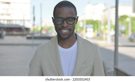 Portrait Of Agree African Man Shaking Head In Approval Outdoor