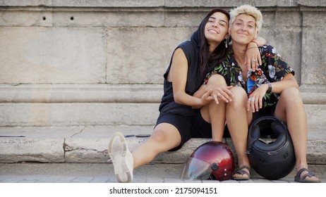 Portrait of an alternative gay couple with motorcycle helmets - Shutterstock ID 2175094151