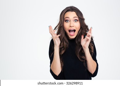 Portrait of amazed woman looking at camera isolated on a white background