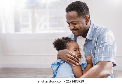 Portrait Of American African Father Daughter Hugging Laughing In Living Room. Happy Daddy And Little Girl Spending Leisure Time At Home. Single Dad, Family Lifestyle Father's Day Concept Banner