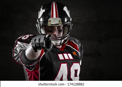 Portrait Of American Football Player Pointing At You 