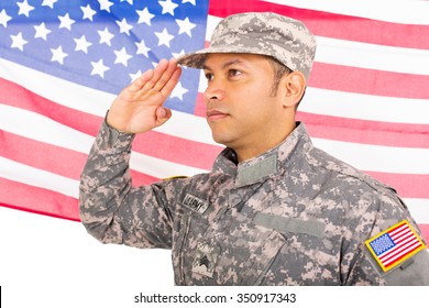 Portrait Of American Soldier Saluting On Us Flag Background