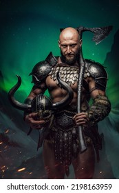 Portrait Of Ancient Nordic Warrior Dressed In Armor Holding Axe Against Northern Lights.