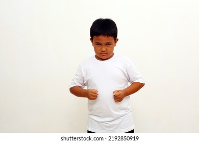 Portrait Of Angry Asian Boy Showing Frustration And Disagreement, Isolated On White Background