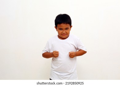 Portrait Of Angry Asian Boy Showing Frustration And Disagreement, Isolated On White Background