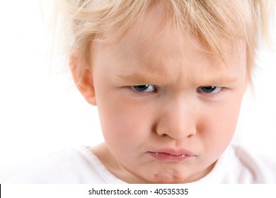 Portrait of an angry blond baby-girl