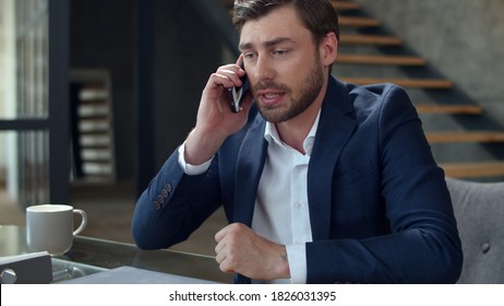 Portrait Of Angry Businessman Talking Phone At Home Office Emotionally. Closeup Stressed Business Man Calling On Cell Phone In Slow Motion. Frustrated Man Having Problem On Workplace.