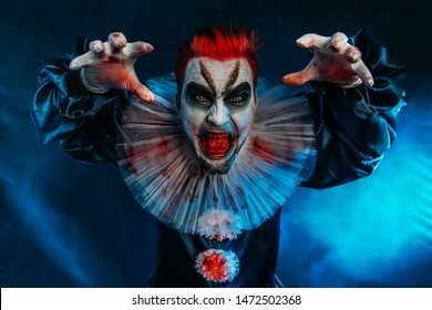 A portrait of an angry crazy clown from a horror film. Halloween, carnival.