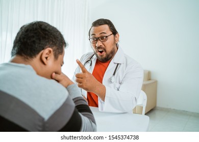 Portrait Of Angry Doctor Warn His Patient To Obey What He Said To Get Healthy