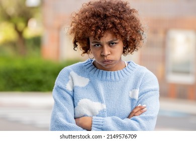 Portrait Of Angry Or Furious Girl In The Street