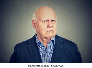 Portrait Of An Angry, Grumpy Senior Business Man, Isolated On Gray Background