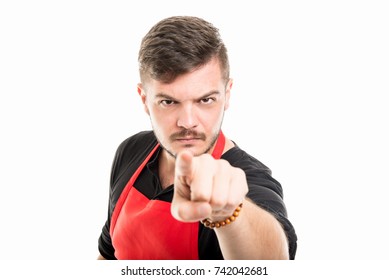 Portrait Of Angry Male Supermarket Employer Pointing Camera Isolated On White Background