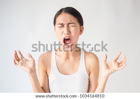 Portrait of angry pensive mad crazy asian woman screaming out (expression, facial), beauty portrait of young asian panic drama woman. Stress burnout office syndrome overload workhard girl concept