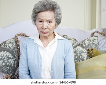 portrait of an angry senior asian woman.