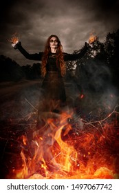 A portrait of an angry witch near the fire. Magic, dark force, spell.  - Shutterstock ID 1497067742
