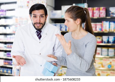 Portrait Of Angry Woman Client Who Is Dissatisfied Of Recommended Medicines In Pharmacy.