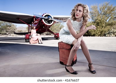 Portrait Of An Annoyed Passenger, Waiting For Her Flight. With A Classic Private Plane