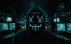 Portrait Of An Anonymous Man, Hacker Wearing Neon Mask Over Dark Room Background